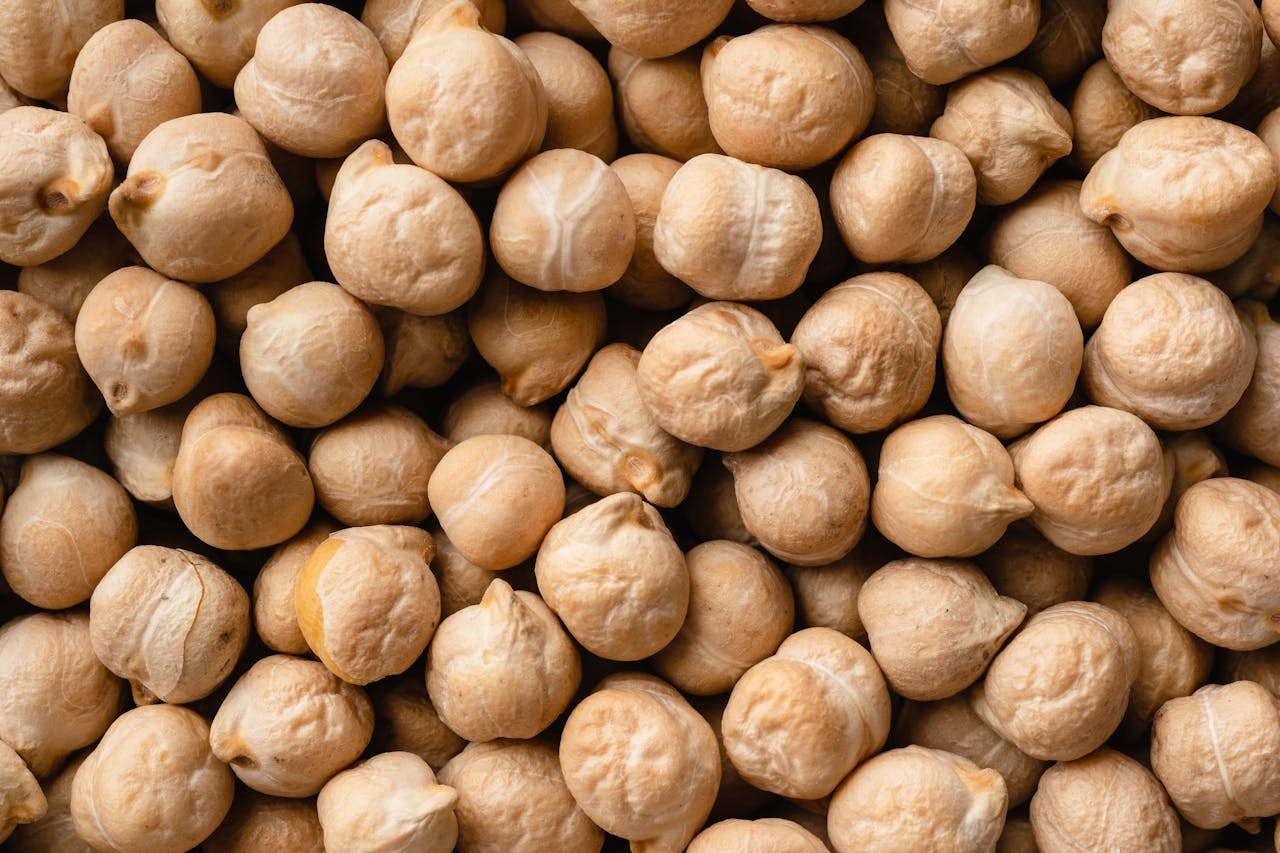 why-choose-us Detailed close-up image of raw chickpeas, highlighting texture and natural color.
